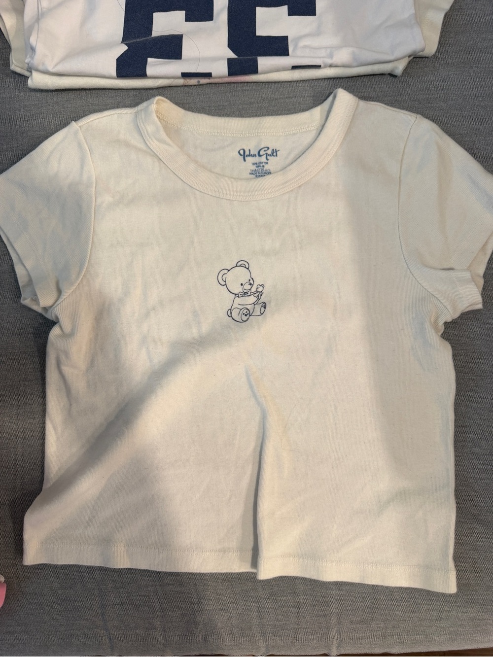 Brandy Melville Cream Short Sleeve Tee with Small Navy Bear Graphic